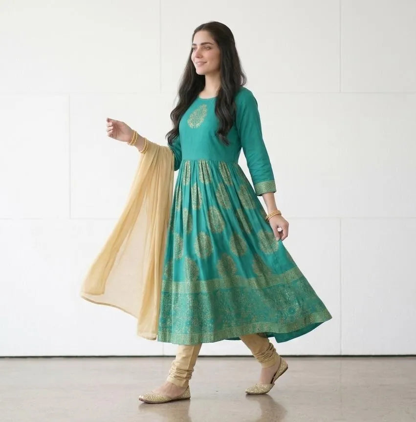 Model wearing Green Arabic Lawn Maxi Set – seated casual pose